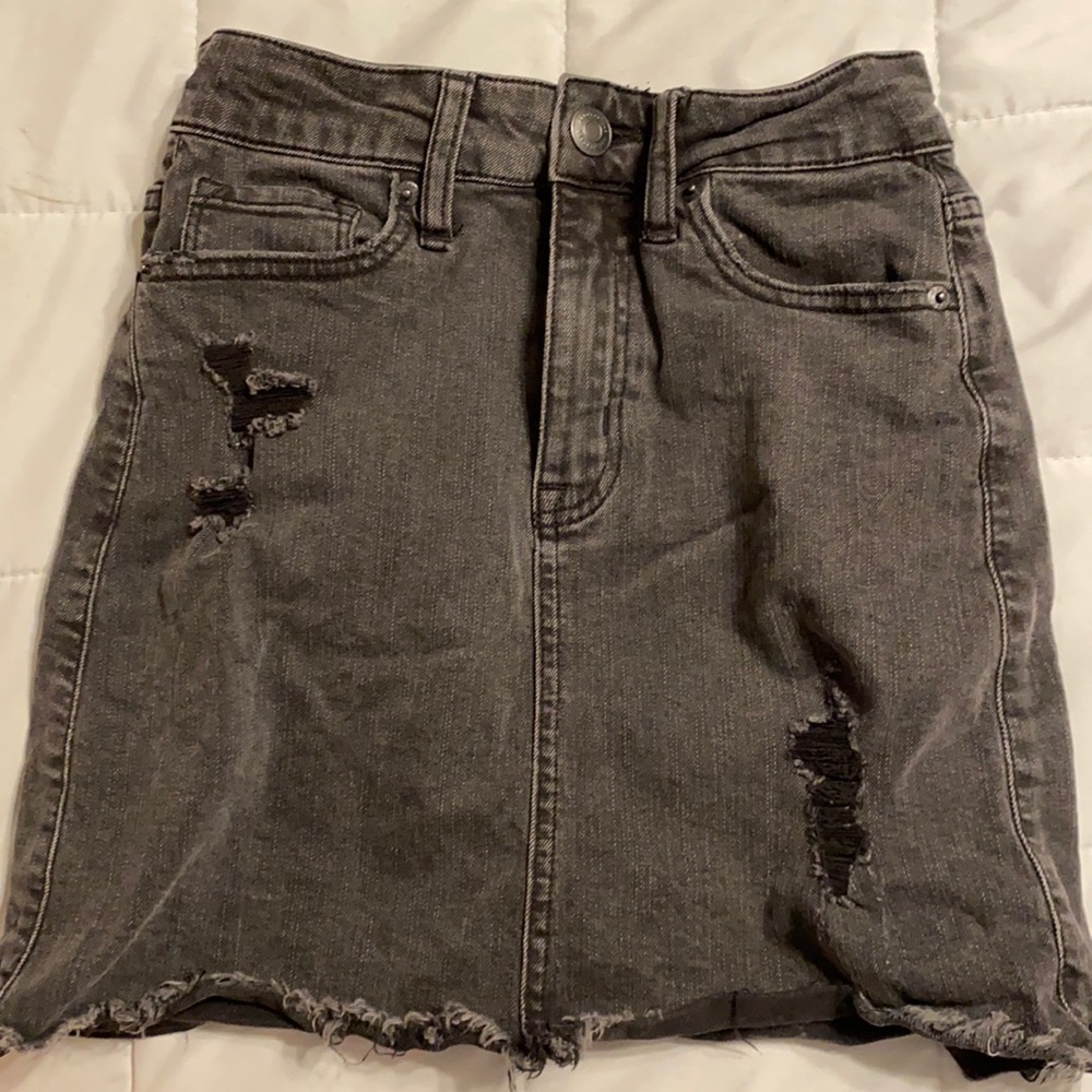black denim skirt, with with rips.